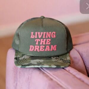 Olive Green Camo Trucker Hat with Pink "Living The Dream" puff art